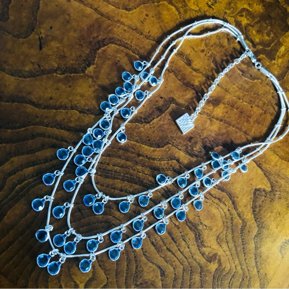Vintage Anne Klein lion triple strand framed blue crystal dangle necklace